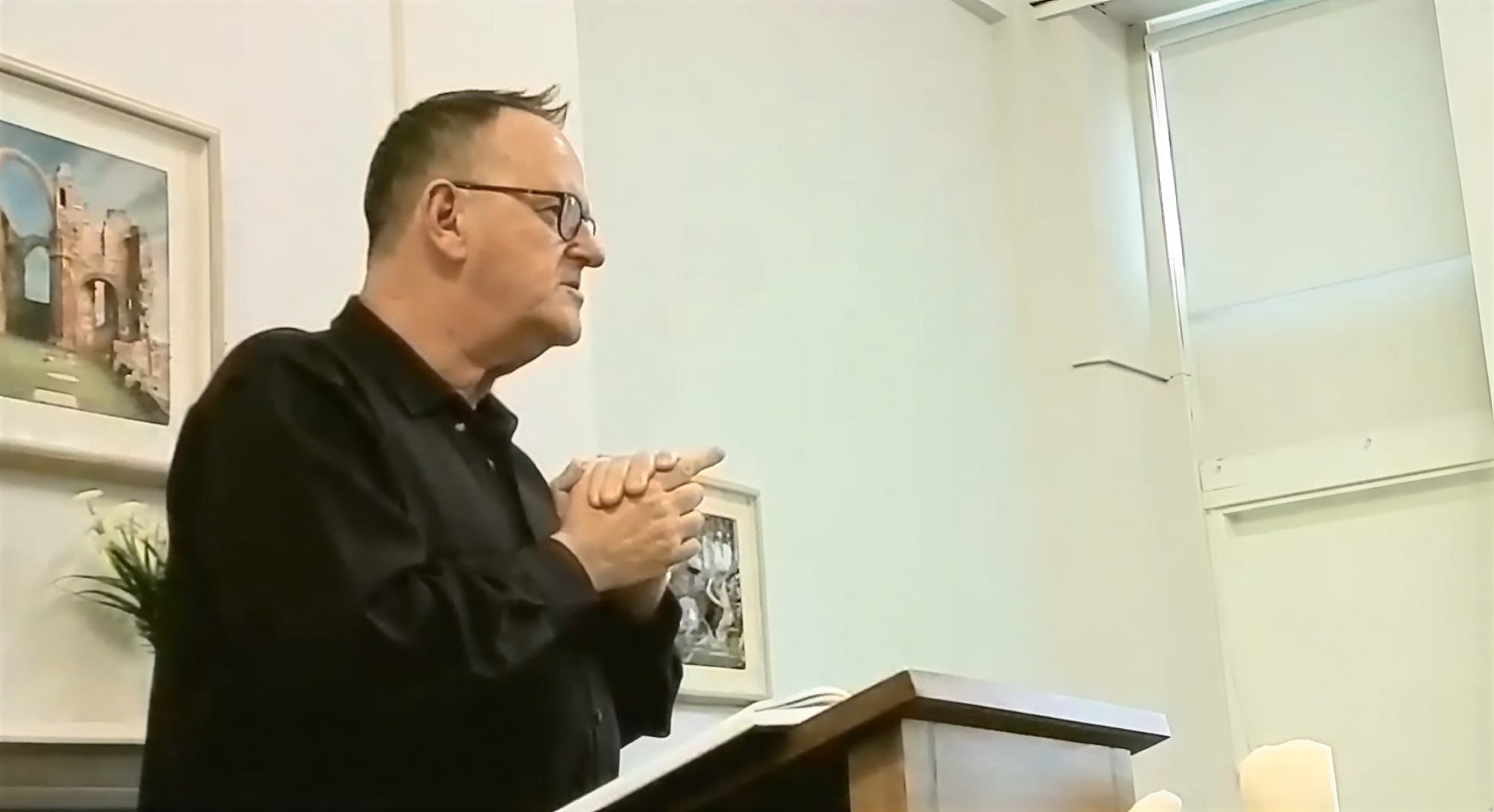 Paul conducting a funeral service